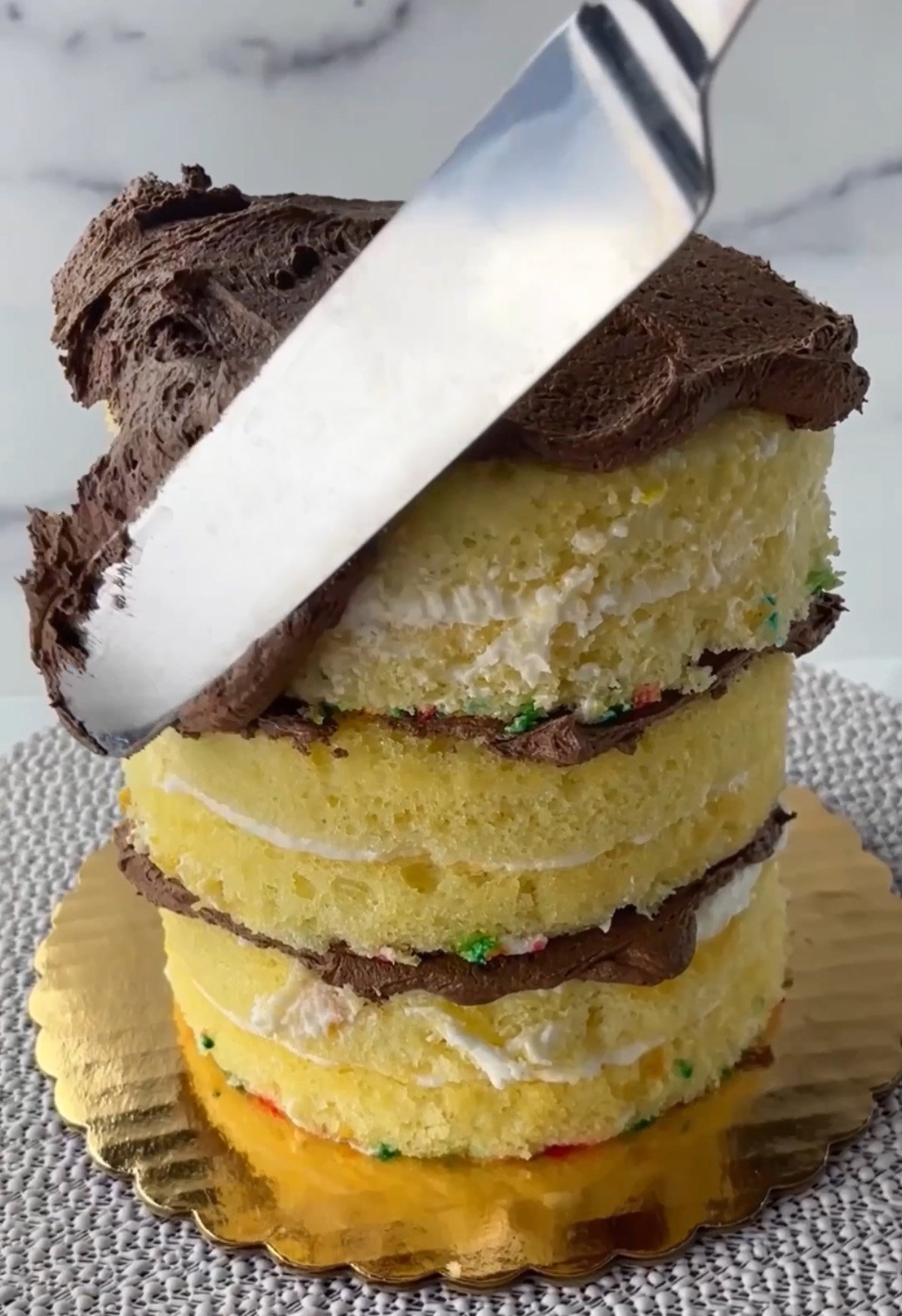 Three layer yellow cake with chocolate frosting.