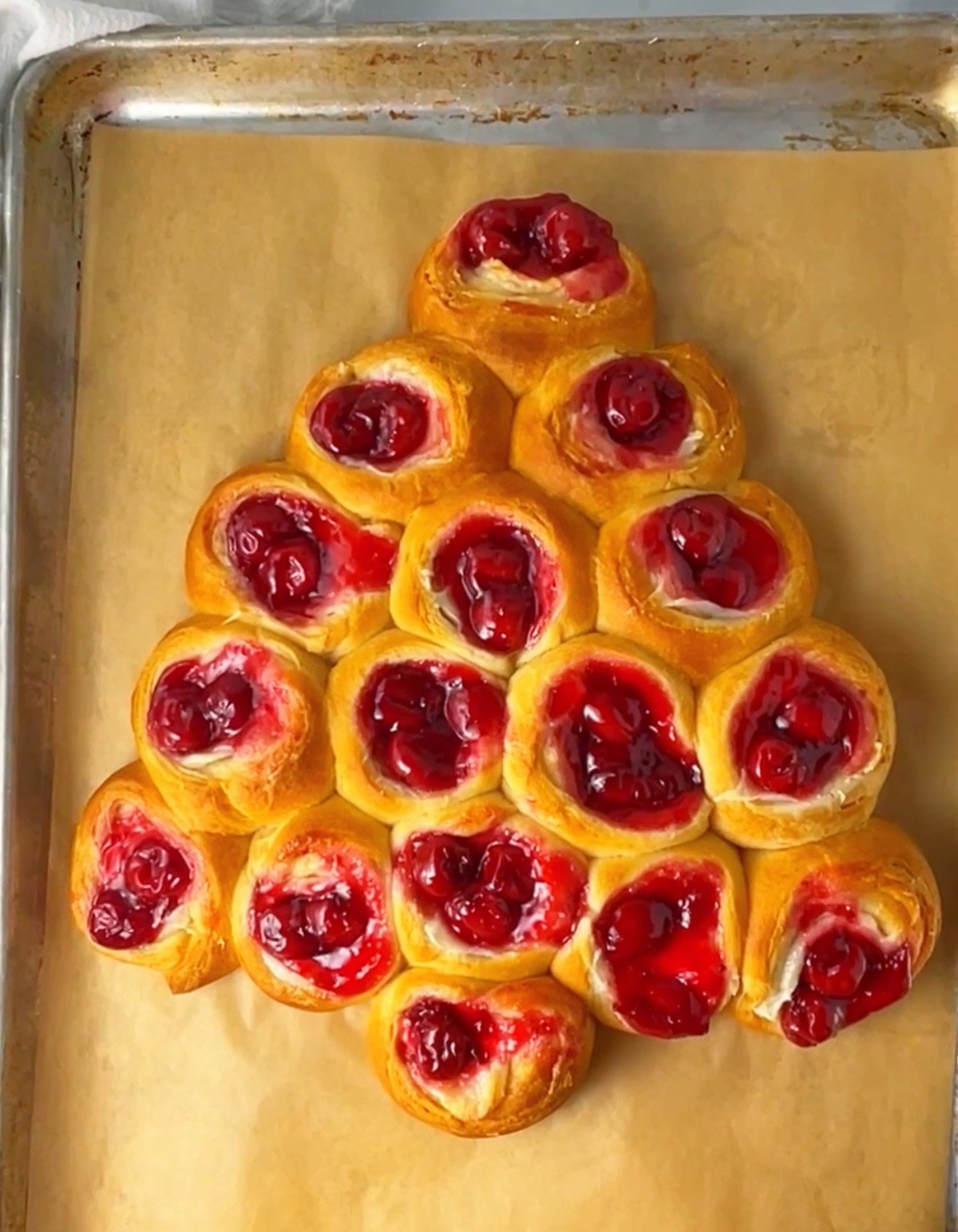 Baked cherry cheese danish in tree shape.