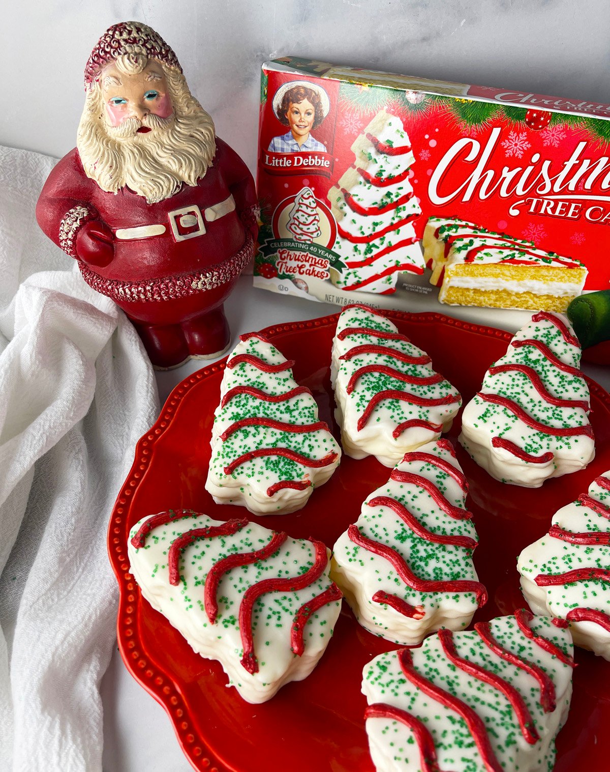 Copycat Little Debbie Christmas Tree cakes on a red plate.