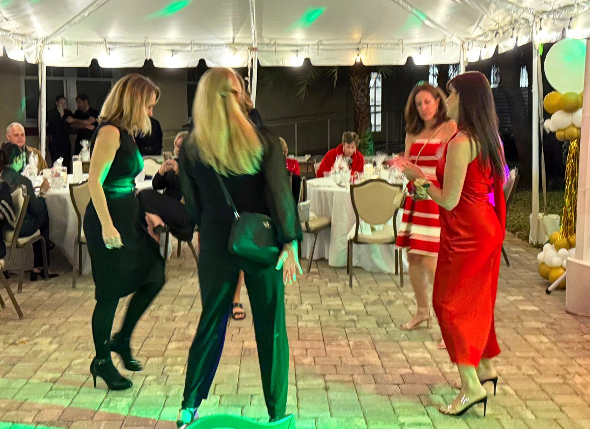 Ladies dancing at fancy birthday party at the Fenway Hotel.