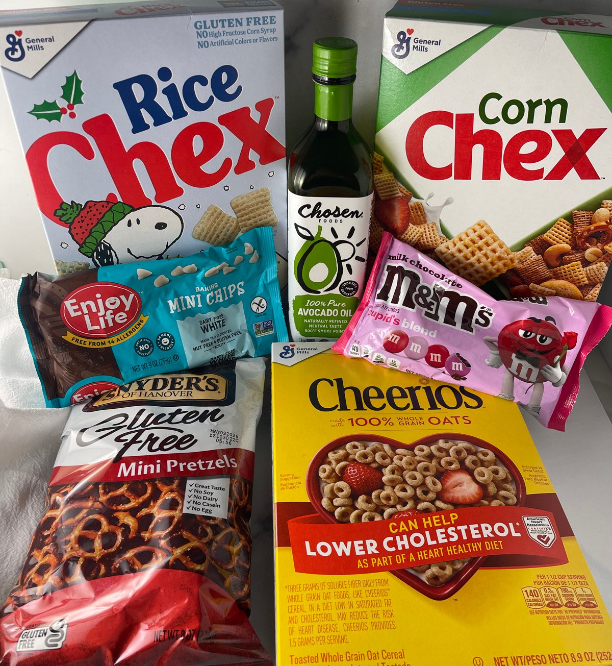 Ingredients needed to make a valentine chex party mix.