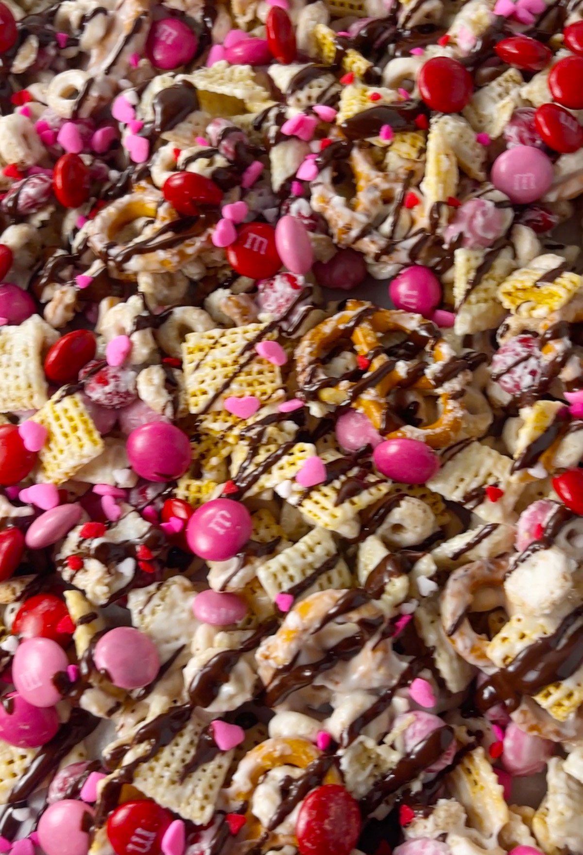 Tray of colorful Valentine's Day white chocolate snack mix.