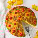 Star fruit upside down cake with slice taken out.