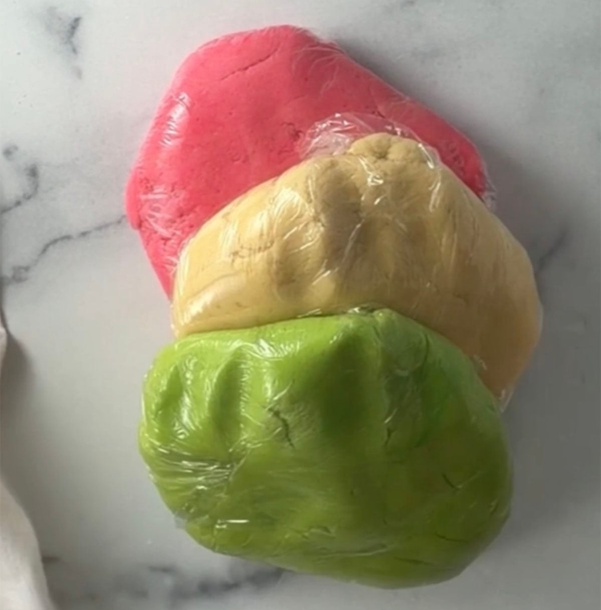 Watermelon sugar cookie dough on counter.