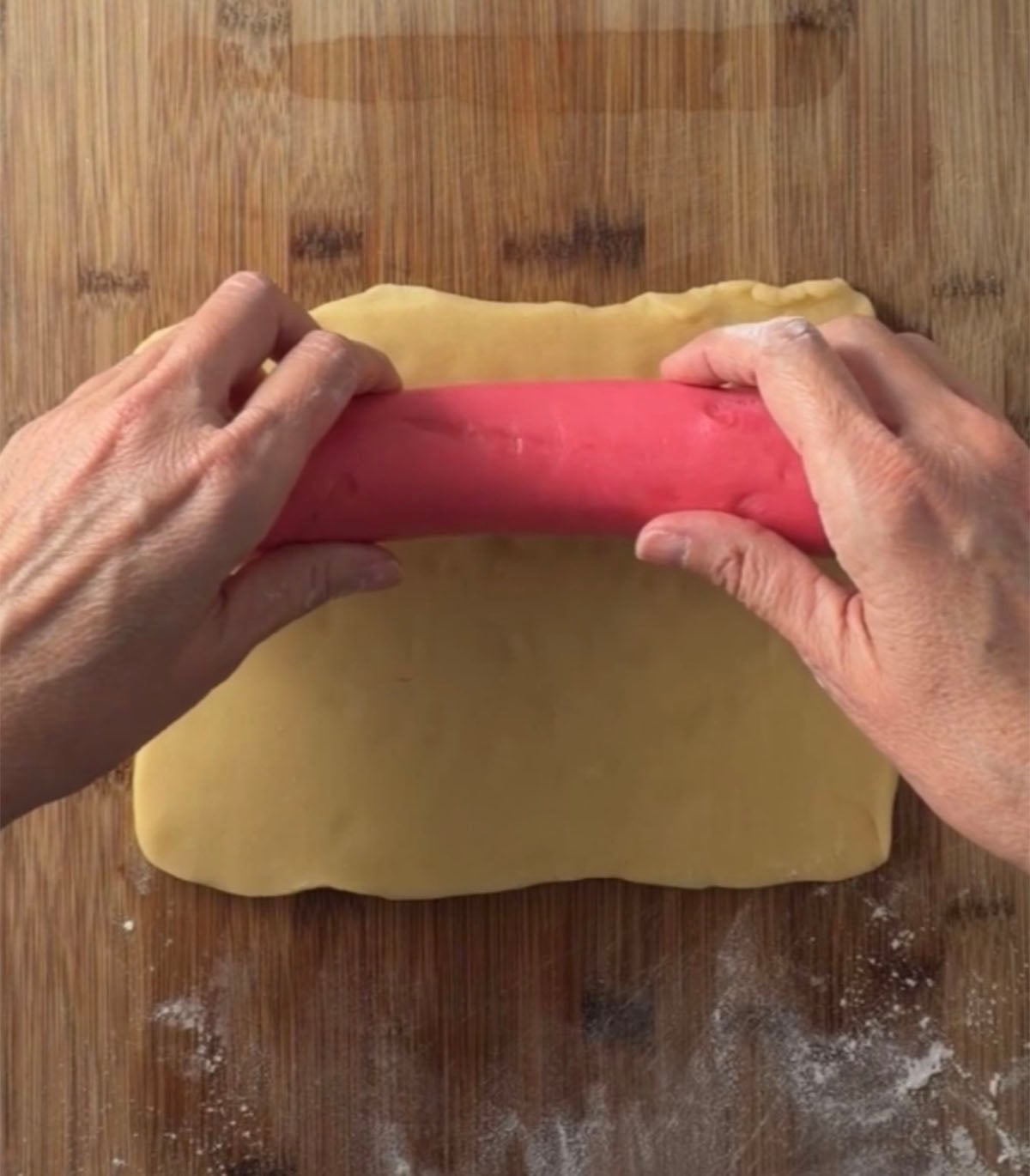 Creating watermelon cookie dough log.