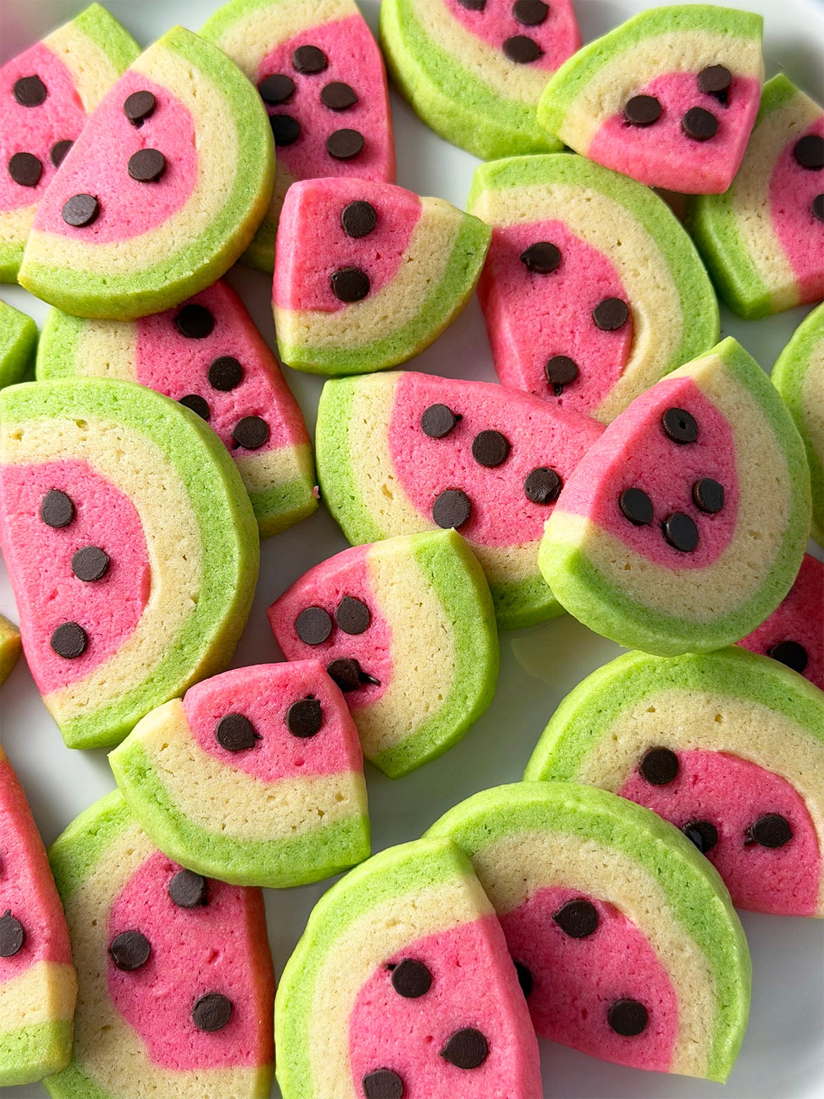 Slice and bake watermelon cookies with mini chocolate chip seeds.