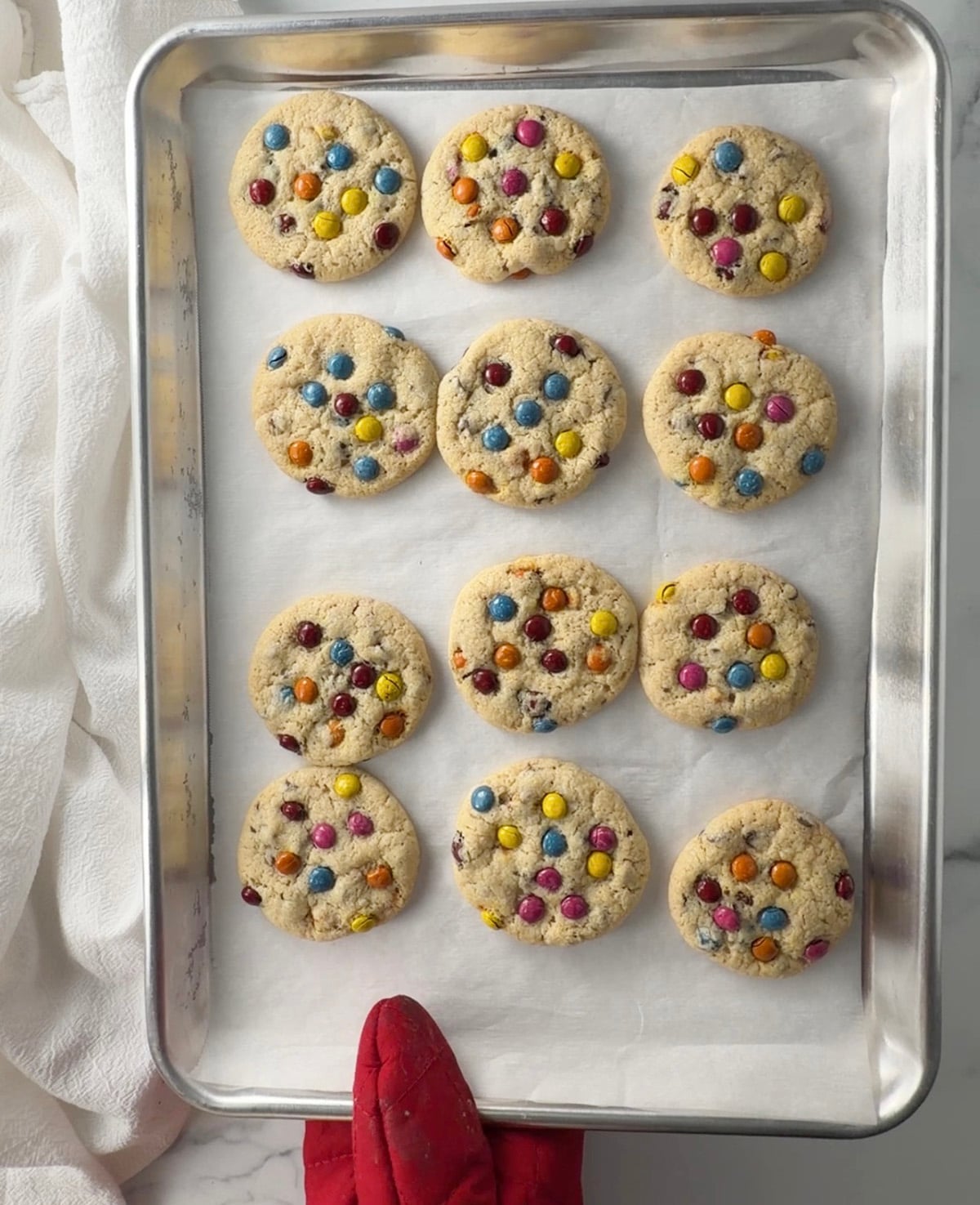 Baked gluten free cookies on a baking sheet.