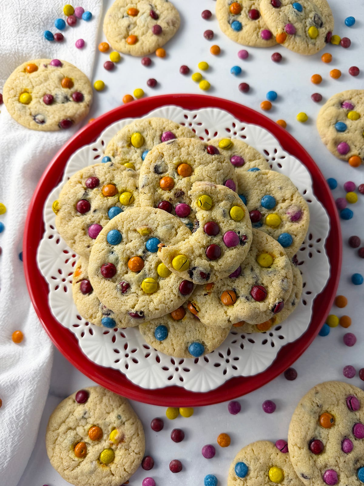 Plate of gluten free chocolate chip cookies with rainbow mini pieces.