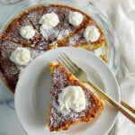 Grandma's recipe for impossible pie on a plate with whipped cream.
