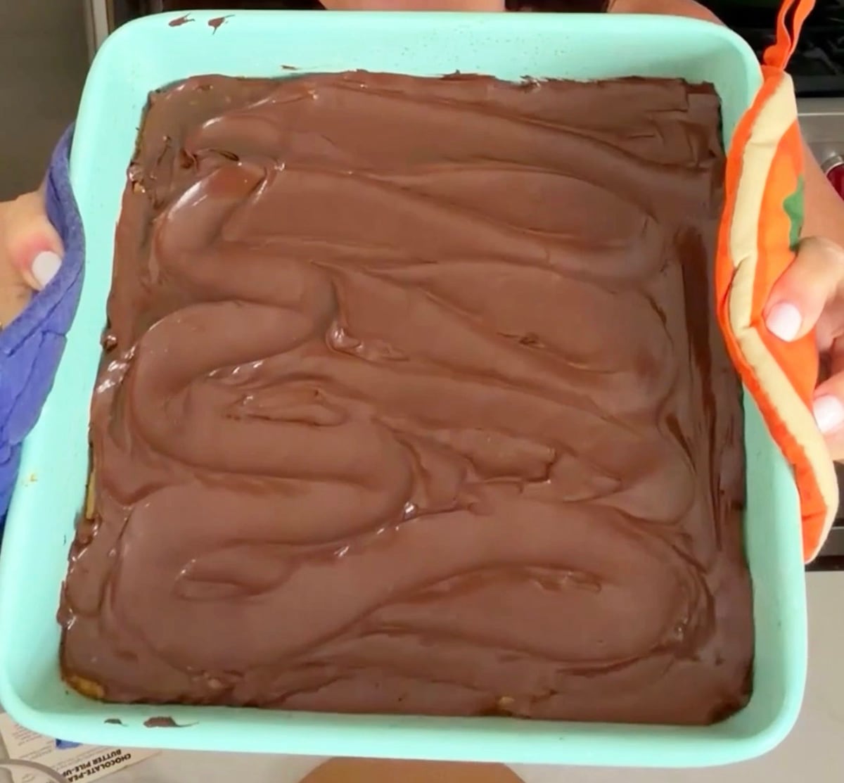 Close up photo of chocolate frosting swirls.