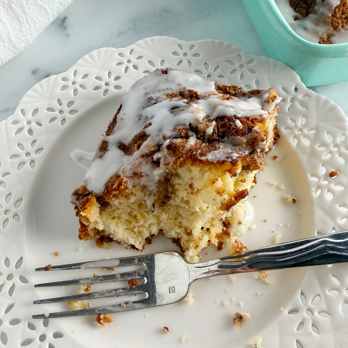 Slice of cinnamon flop cake on plate.