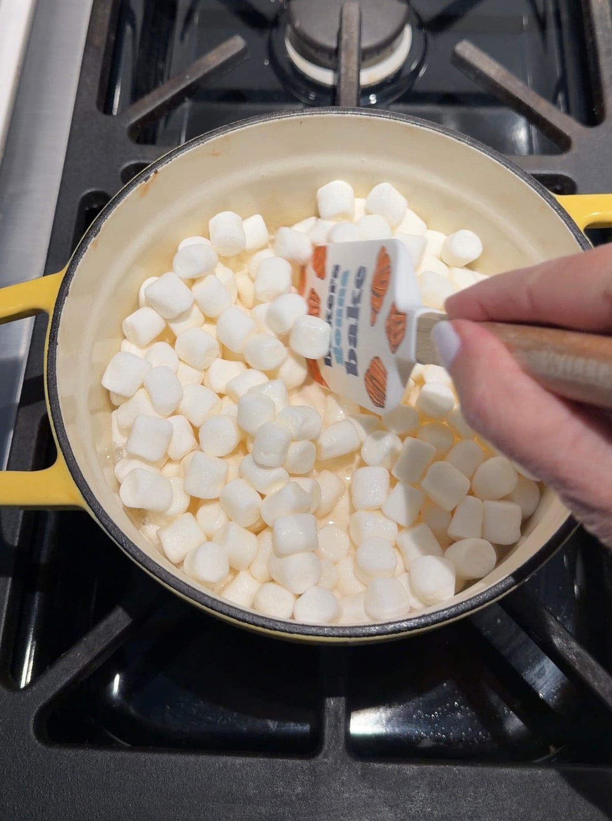 Marshmallows melting in saucepan.