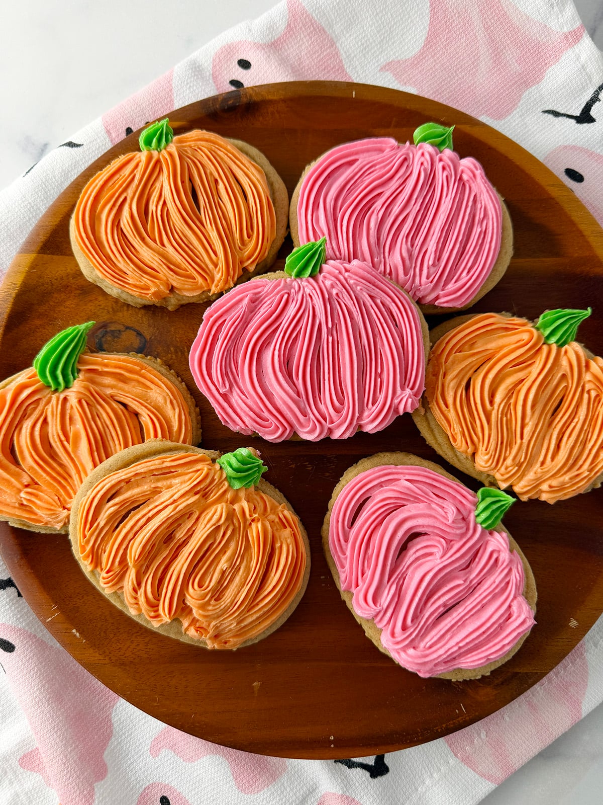 Pumpkin cut-out cookie with buttercream frosting.