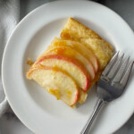 Grandmas easy apple tart served on a small white plate.