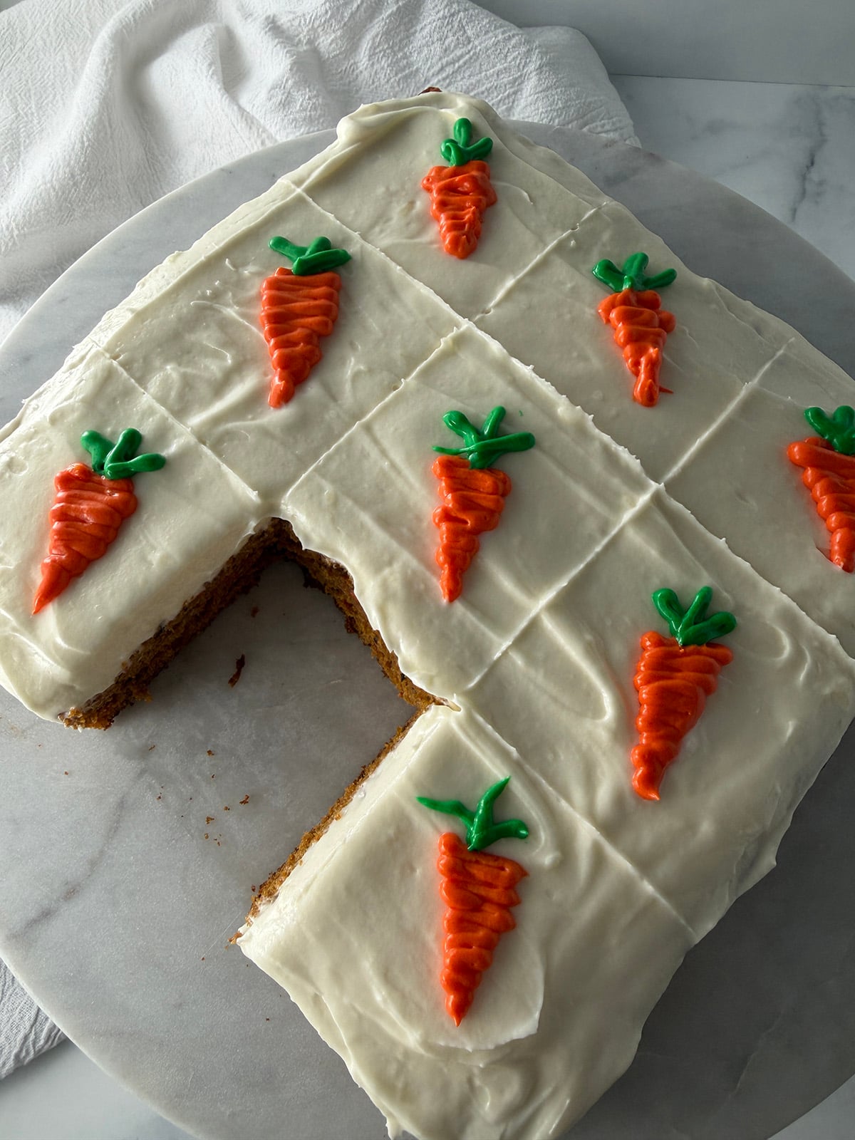 Carrot yogurt squares on a plate.