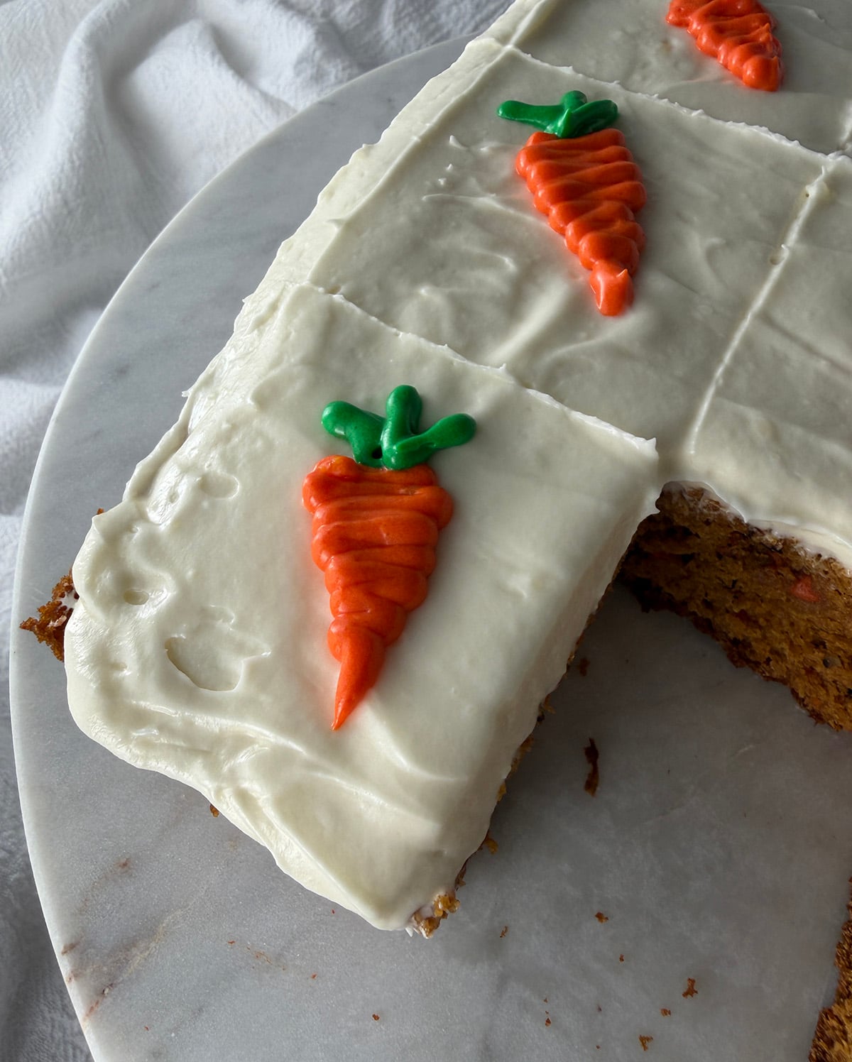 Yummy carrot yogurt squares on a plate.