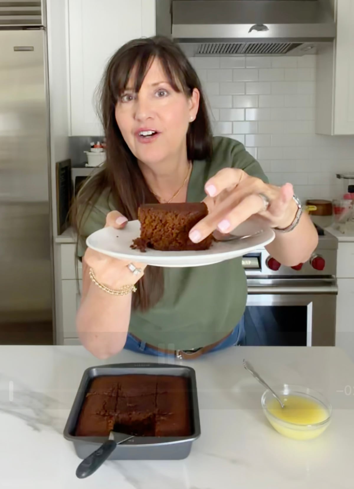 Lise Ode, Mom Loves Baking showing a slice of gingerbread on a plate.